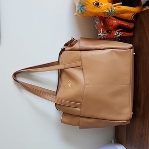 Freshly Picked brown leather diaper bag with changing mat